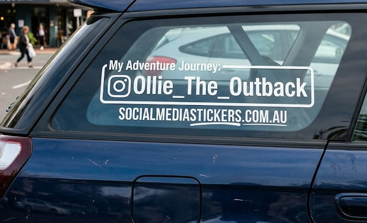 Custom social media handle sticker on a vehicle window